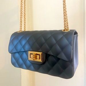 Gray bag with gold hardware